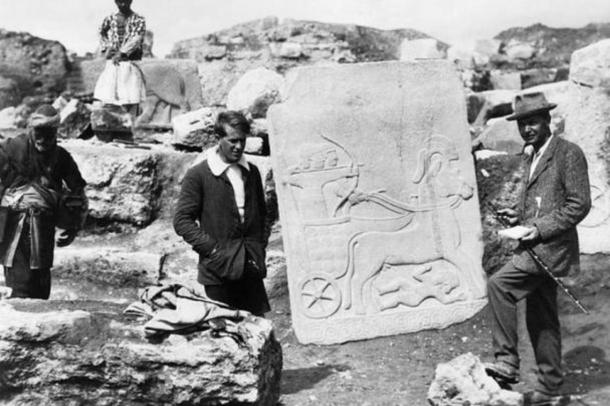 E Lawrence with Leonard Woolley, the archaeological director, with a Hittite slab on the excavation site at Carchemish near Aleppo before the First World War. An archer riding a chariot can be seen on the slab.