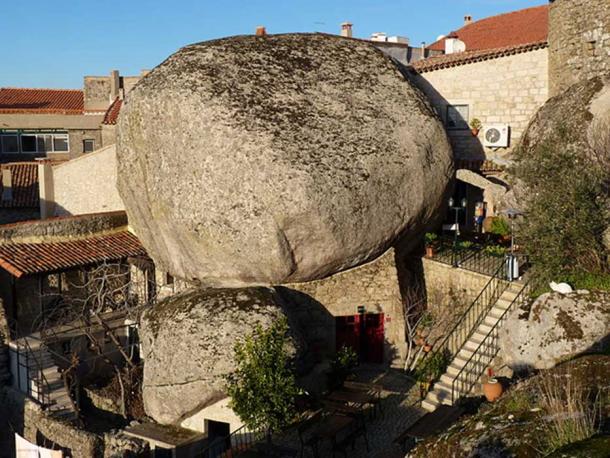 House constructed under a rock in Monsanto.