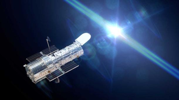 Hubble Space Telescope observing a star. (dottedyeti / Adobe Stock)
