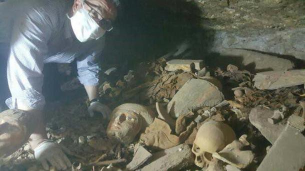 Human remains and artifacts were found scattered in the tomb. 