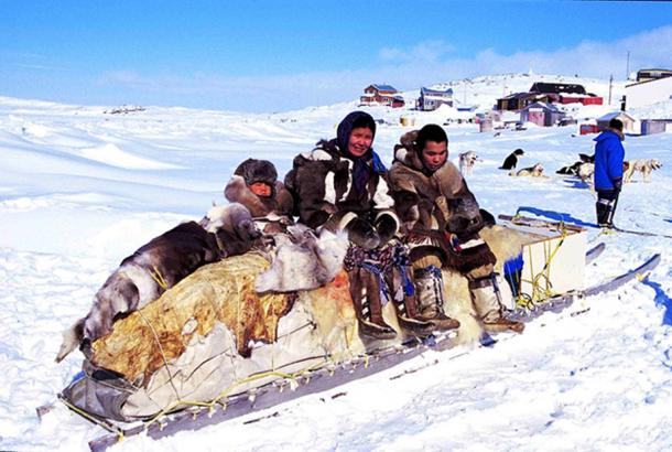 Inuit people on a traditional qamutik (sled), Cape Dorset. (Ansgar Walk/CC BY SA 2.5)