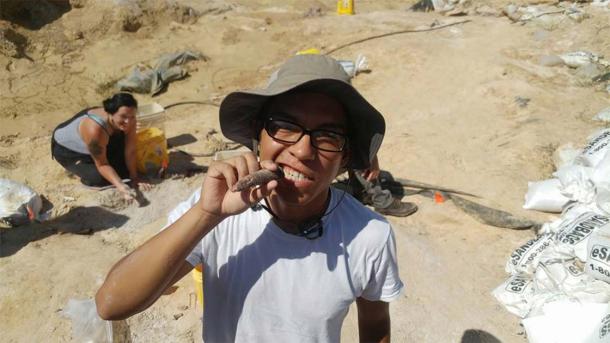 Issac Magallanes with a juvenile gomphothere tusk. (Florida Museum)
