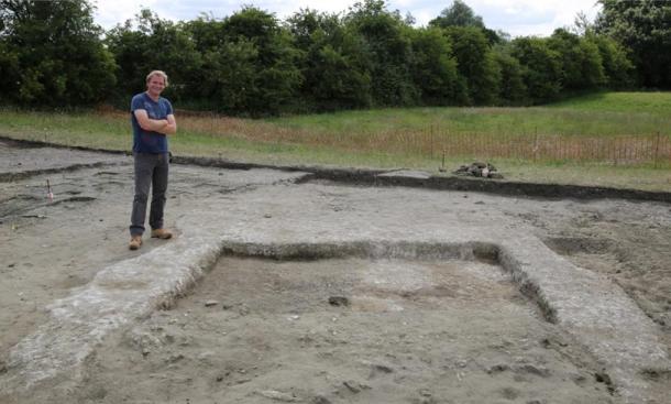 Jim Leary, lead archaeologist, with the remnants of the walls and the floor of the ancient home at Marden Henge