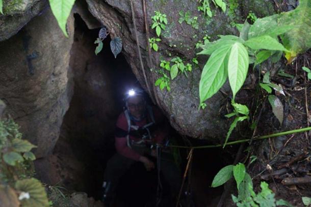 John in one of the cave entrances.