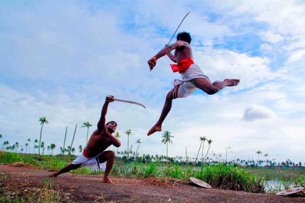 Two Kalaripayattu swordsmen in mock sword against sword martial arts combat in Kerala. (Phil Bus / CC BY-SA 2.0)