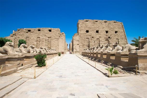 The Temple of Karnak in Luxor, Egypt, seen through the walkway of ancient Egyptian sphinxes with rams’ heads. (Pakhnyushchyy / Adobe stock)