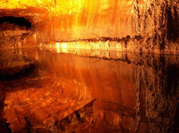The chambers and veins of salt are reflected in the perfectly still brine water pools of Khewra Salt Mine.