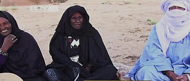 Khoulene Alamine, center, has played the imzad since age 10. She is now in her 80s and teaches other women and girls to play.