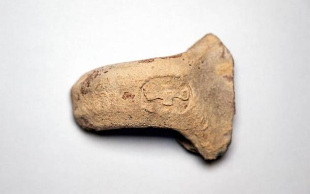 Two-winged royal ancient Hebrew 'LMLK' seal impression from the Kingdom of Judah. (Yaniv Berman / Israel Antiquities Authority)