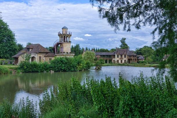 Le hameau de la reine by the artificial lake in the gardens of the Petit Trianon.