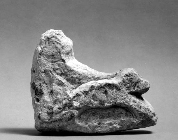 Limestone group of a monkey driving a chariot. The piece is unfinished being roughly blocked out. The back and one side have been outlined in black paint or ink though much of this is now worn away. 18th Dynasty. Tell el Amarna. Brooklyn Museum, New York.