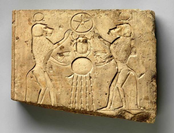 Limestone relief panel showing two baboons offering the wedjat eye to the sun god Khepri, who holds the Underworld sign. Late Period–Ptolemaic Period. Metropolitan Museum of Art, New York.
