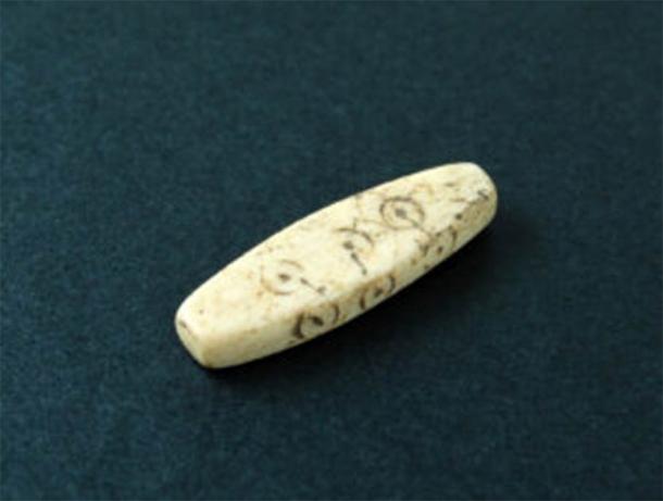 Lozenge-shaped gaming piece found at Northgate construction site, Chester. (Oxford Archaeology)
