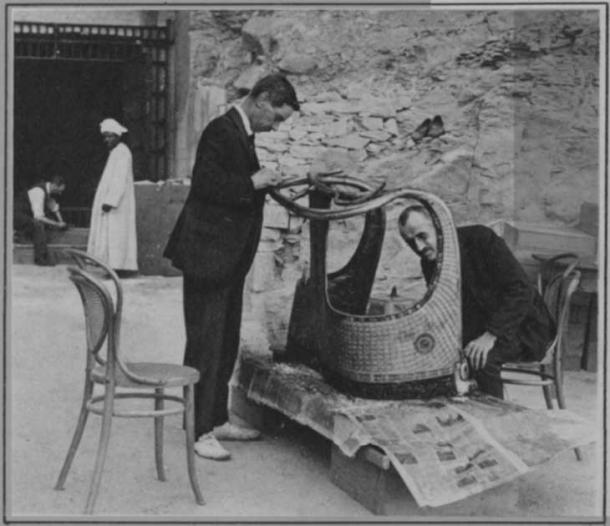Arthur Mace and Alfred Lucas, conserve a chariot from Tutankhamun’s tomb outside the 'laboratory' in the neighboring tomb of Seti II, December 1923. Published in 1928 as part of Mace's obituary.