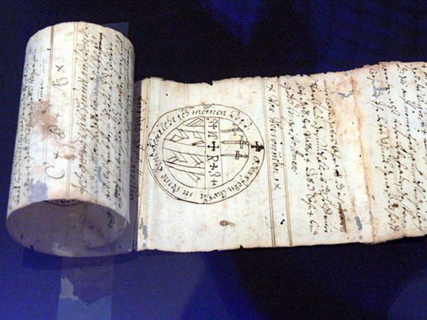 Magic words and signs on a rolled strip of paper (18th century). Upper Austrian County Museum