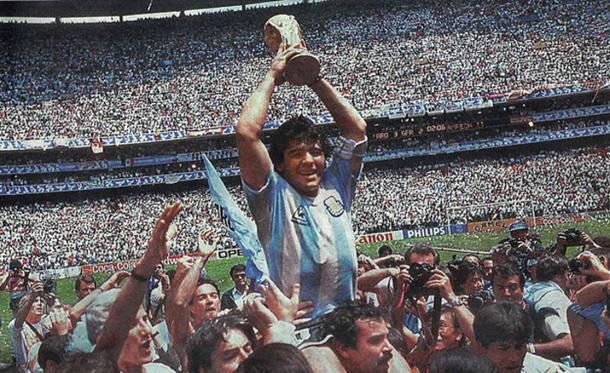 Maradona raises the World Cup for Argentina in 1986. (Public Domain)
