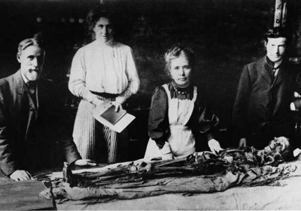Margaret Murray famously unwrapping the Khnum-Nakht Mummy publicly in 1908. 