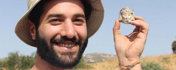 Mario Tobia, a student at Azrieli College of Engineering in Jerusalem, found this figure head on his first day at the excavation. (Azusa Pacific University)