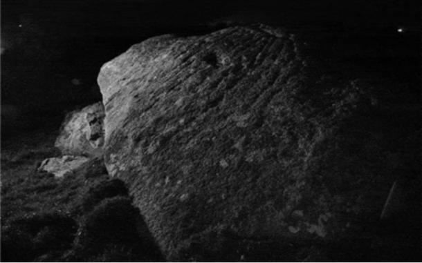 Marks on the rock came into view under a camera flash and would have lit up in moonlight Credit: Dr Andy Jones