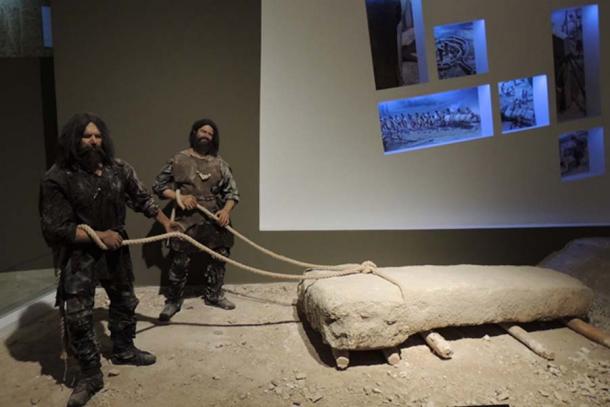 Masons hauling a pillar about the size of the Vulture Stone. Credit: Alistair Coombs
