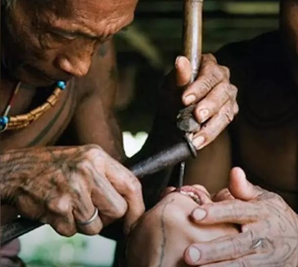 Maya dentists spun thin copper tubes in their hands which served as drills, with the abrasive quality coming from powdered quartz mixed in water. (YouTube screenshot / Nutty History)