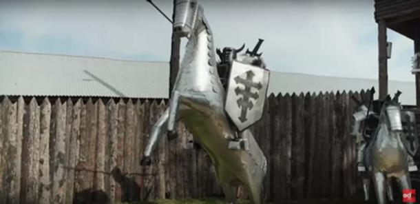 Medieval Knights made from old washing machines guard the site (ODN / YouTube Screenshot)