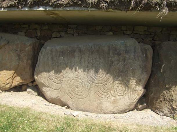 Megalithic carved stone at Knowth featuring a series of incised spiral markings. 