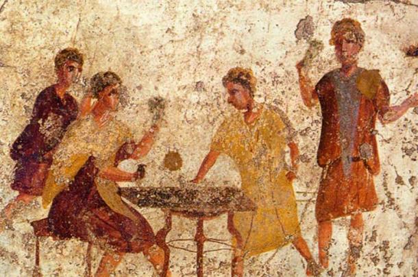 Hombres jugando a los dados en Roma representados en un fresco de Pompeya. (Dominio publico)
