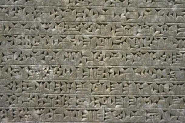 Mesopotamian relief 865-860 BC, showing cuneiform script. (bennnn / Adobe Stock)