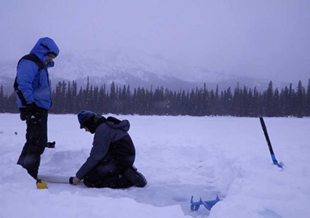 Mikkel W. Pedersen and colleague preparing for coring of the lake sediments. 