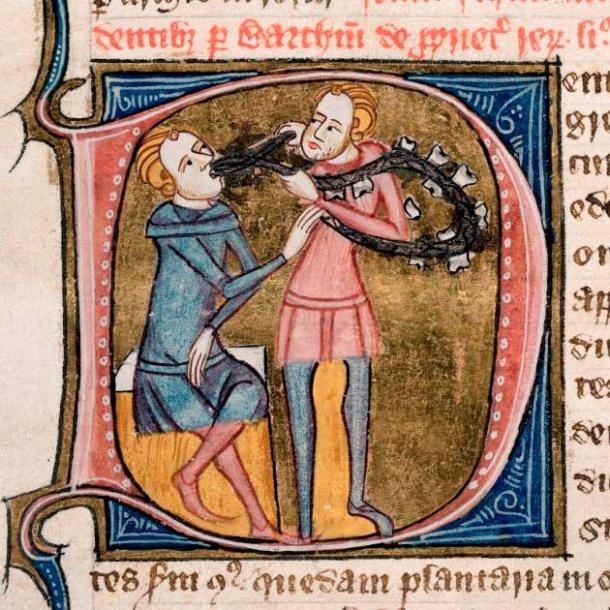 Miniature on an initial 'D' with a scene representing teeth (