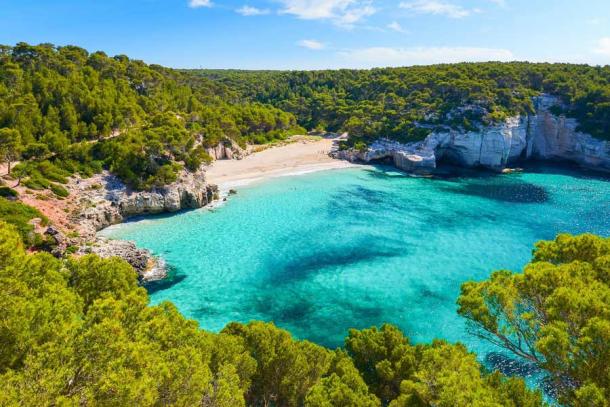 A present-day view of Mitjaneta Beach on Menorca about 5 kilometers southeast of the Son Catlar fortress where the Roman artifacts were found. (pkazmierczak / Adobe Stock)