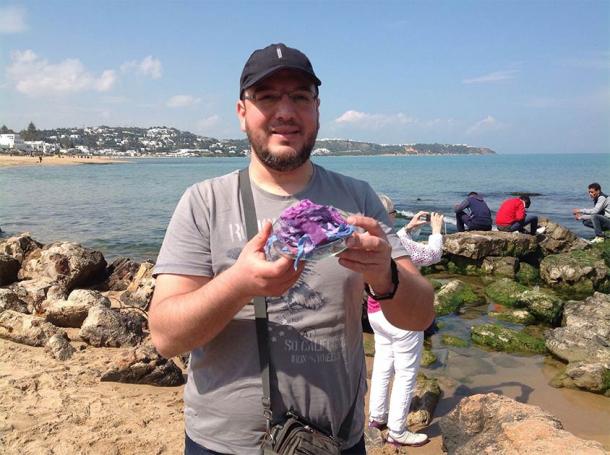 Mohamed Ghassen Nouira holding examples of his ancient purple dye (Mohamed Ghassen Nouira)