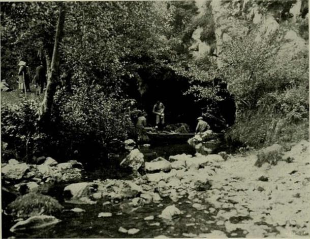 Montesquieu-Avantès, Ariège, Midi-Pyrénées, France. Entrance to the cave of Tuc d'Audoubert, where the river Volp comes back to the surface. Henri Begouën's sons and other people with the raft they used to enter the cave. Photo taken on July 20th, 1913, or 1914, the Begouën family celebrating the 