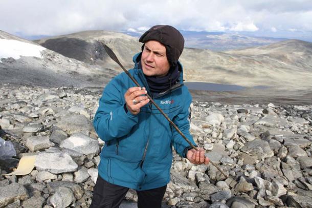 Mountains of Oppland, Norway. Archaeologist with an arrow aged around 1400 years.
