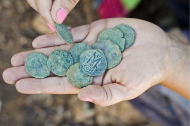 Nine bronze coins dating to the Byzantine period were hidden in the remains of a settlement near a highway to Jerusalem.