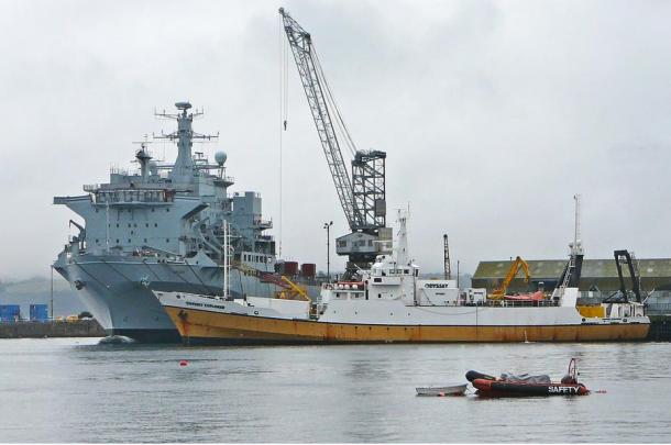 The Odyssey Explorer (midground) in Falmouth Docks, UK.  The salvage vessel belongs to Odyssey Marine Exploration, and is used in the exploration of underwater wreck sites. 