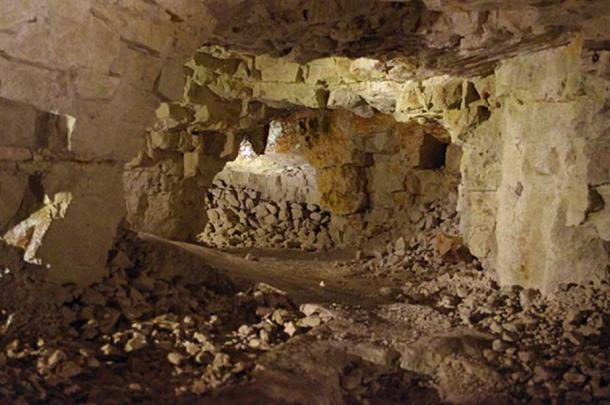One of the galleries, radiating from the bottom of the 9m shaft, with artificial lighting.