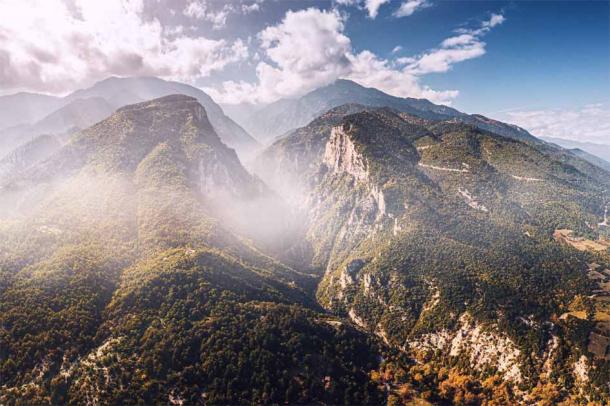 Panoramic view of deep gorge and rocky ridge leading to legendary Mount Olympus (EdNurg / Adobe Stock)