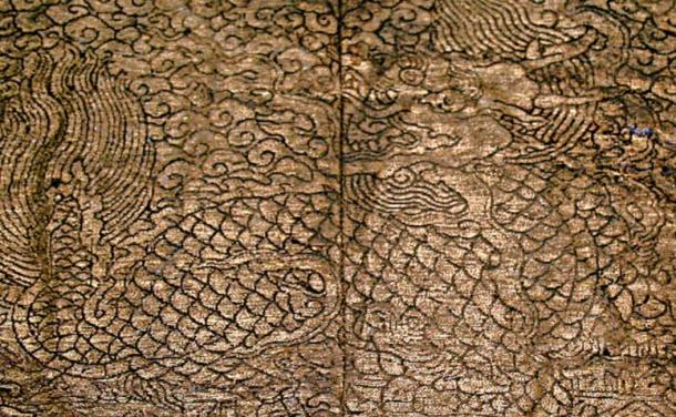 Patches from an undershirt in the wife’s coffin. The patches depict a Kylin or Qilin, a mythical creature with a dragon’s head, tail and a scaly body