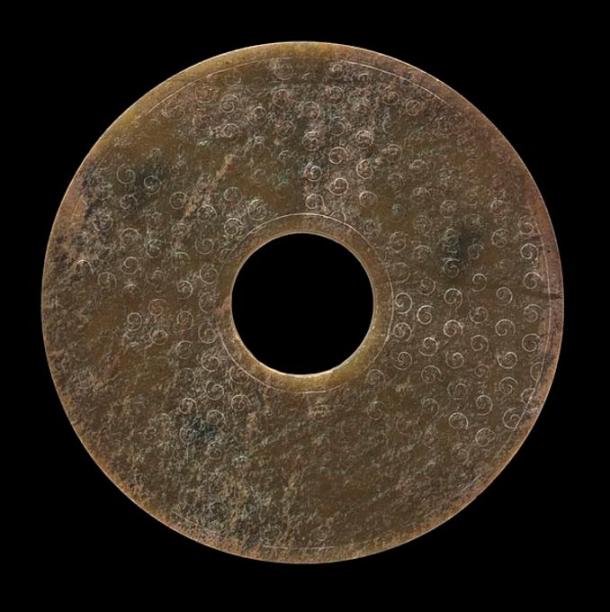 Perforated Chinese Disk (Bi) with unfinished Relief Spirals, circa 481-100 BC.