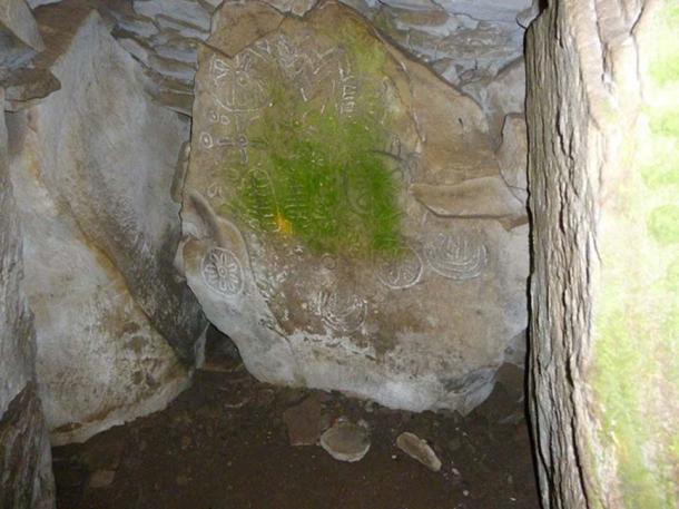 Petroglyphs inside cairn T