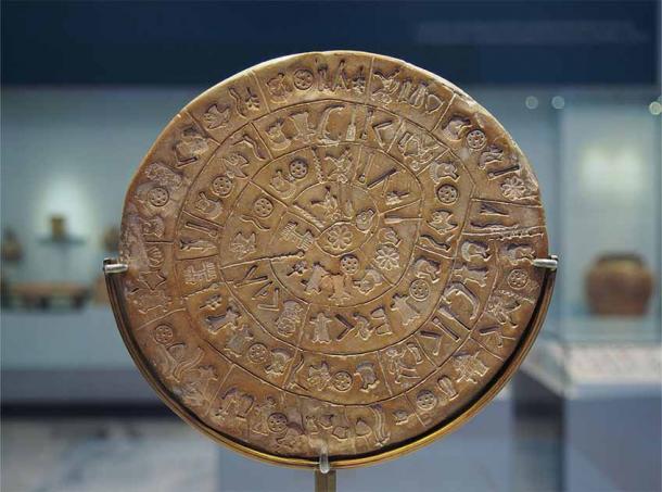 Side A of the Phaistos Disc, on display at the Archaeological Museum of Heraklion. First discovered at the ruins of Phaistos, the disk is covered with undeciphered codes. (C. messier / CC BY-SA 4.0)