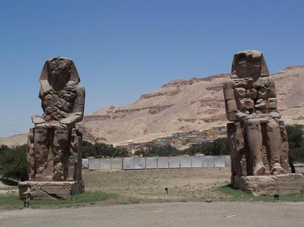 Pharaoh Amenhotep III's Sitting Colossi of Memnon statues at Luxor, Egypt.