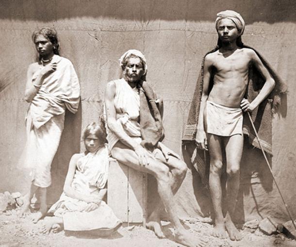 Photograph of two men and two women of the Malaiyali tribe in the Shevaroy Hills in Tamil Nadu - 1860s. (