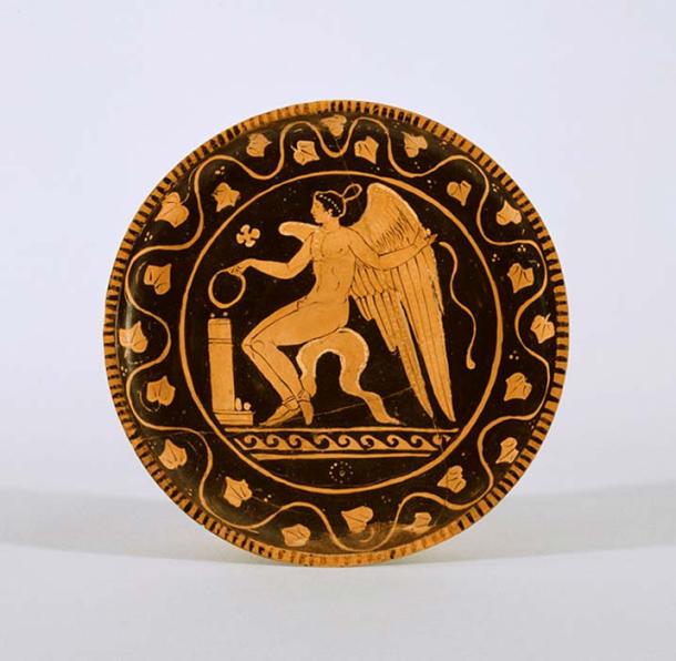 A Red-Figure Plate with Eros as a youth making an offering. 
