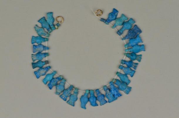 Pomegranate necklace from Amarna, made of blue faience ceramic. (Courtesy of National Museums Liverpool, World Museum)