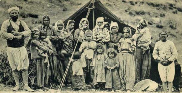 Postcard of group of Romani people in front of their tent in Smyrne. (Public Domain)