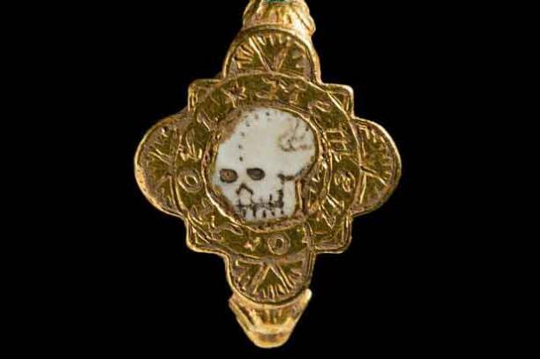 A post-medieval gold finger posy ring inlaid with white enamel, found in the Carreghofa Community, Powys, Wales. (National Museum Wales)