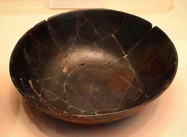 Pottery Bowl Early Predynastic, Badarian Fifth millennium BC From El-Badari In addition to the regular black top and interior, this bowl has the characteristic faint grooved pattern of the Badarian period on its surfaces.